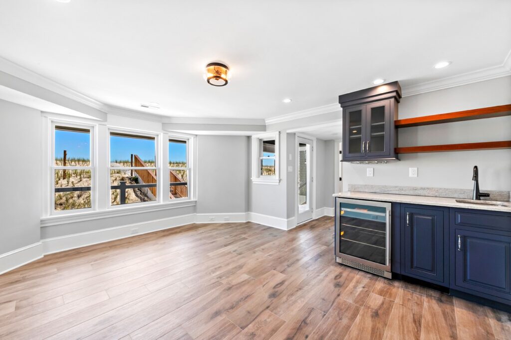 interior room view looking out the window at the beach of a renovated home with wine fridge by Renovations Contractor Interior JS Pro Construction Long Beach Island, NJ